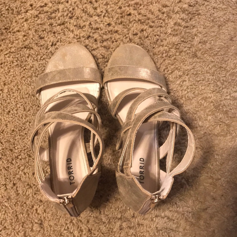 I am selling gold torrid wedges